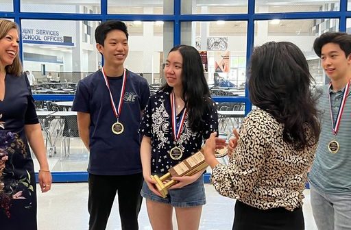 Students gather in celebration of their win.